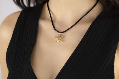 Pendente animals stella marina in oro giallo 18kt con laccio